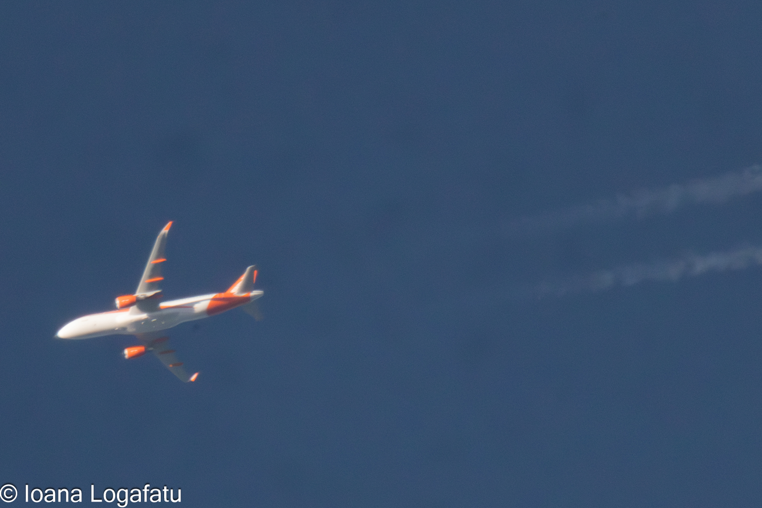 Aircraft gliding gracefully through a clear sky